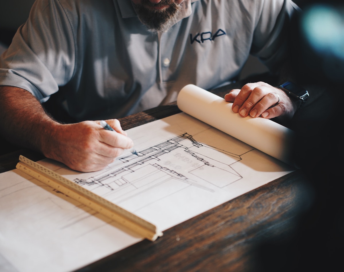 Construction drawings and structural plans being drafted